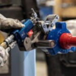 a worker following hydraulic tools safety procedures