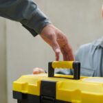 2 workers following the proper torque tool storage and care