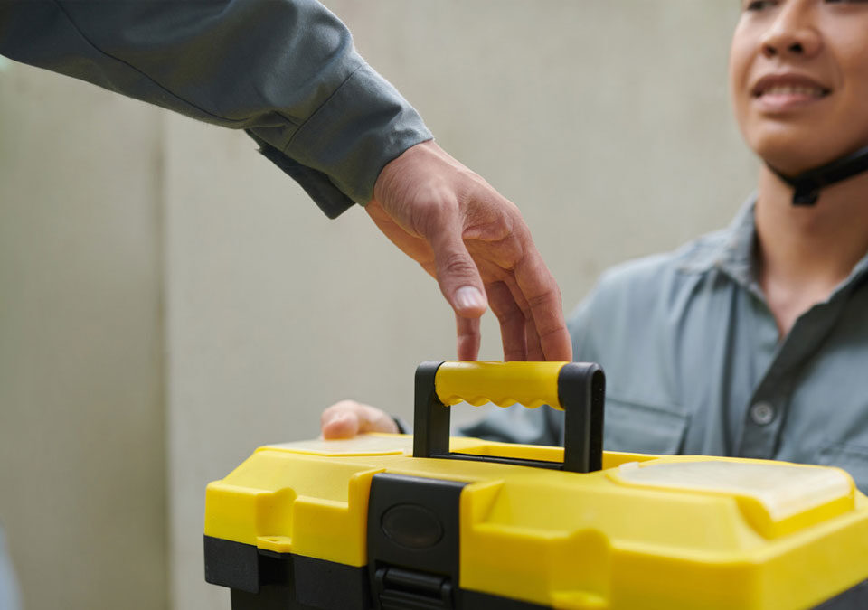 2 workers following the proper torque tool storage and care