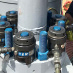 Torqlite hydraulic bolt tensioners on-site, illustrating reliable tensioner rental services for industrial bolting.