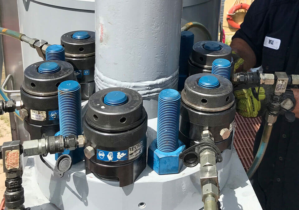 Torqlite hydraulic bolt tensioners on-site, illustrating reliable tensioner rental services for industrial bolting.