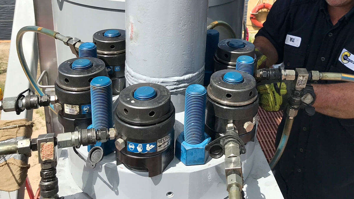 Torqlite hydraulic bolt tensioners on-site, illustrating reliable tensioner rental services for industrial bolting.